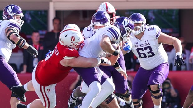Nebraska defensive tackle Nash Hutmacher earns a tackle for loss during the 17-9 win over Northwestern (Oct. 21, 2023)